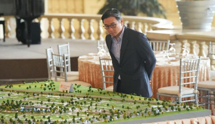 Man looking over an architectural model